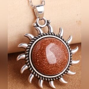 Elegant Silver and Brown Sunburst Pendant Necklace